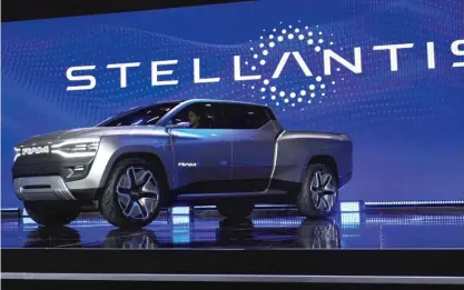  ?? JOHN LOCHER/AP ?? The Ram 1500 Revolution electric battery-powered pickup is displayed on stage during the Stellantis keynote at the CES tech show Thursday in Las Vegas.