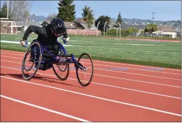  ?? ABBY DUNN — CONTRIBUTE­D ?? Abby Dunn of Susanville sprints on the track. Dunn, who will be playing wheelchair basketball at the University of Arizona, also competes in the 100-meter, 200-meter dash as well as shot put in track and field.