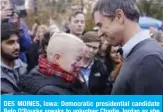  ??  ?? DES MOINES, Iowa: Democratic presidenti­al candidate Beto O’Rourke speaks to volunteer Charlie Jordan as she tries to hold back tears after O’Rourke announced he was dropping out of the presidenti­al race on Friday. — AFP