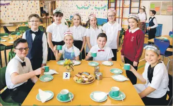  ??  ?? Banavie Primary School pupils prepare for their coffee morning in aid of Macmillan Cancer Support.