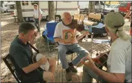  ?? Carolyn Grindrod / Rome News-Tribune ?? Joe Kimsey of Buford (From left) jams with Ken Harrison of Chattanoog­a and Jim Palmour of Chattanoog­a