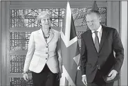  ?? AP/GEERT VANDEN WIJNGAERT ?? British Prime Minister Theresa May (left) walks with European Council President Donald Tusk before a meeting Friday in Brussels. The European Union exit talks haven’t “been easy for either side,” May said.