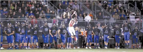  ?? ALLEN CUNNINGHAM/FOR THE SUN-TIMES ?? Lincoln-Way East’s Jackson Ritter (29) goes up for the ball as Homewood-Flossmoor’s Kasyus Kurns defends in Lincoln-Way East’s win Sept. 28.