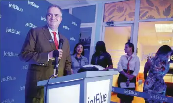  ?? — AFP ?? JetBlue’s Chief Executive Robin Hayes speaks during the opening of a JetBlue ticket office in Havana, Cuba.