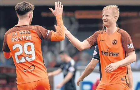  ??  ?? Anthony Ralston congratula­tes Thomas Mikkelsen after his goal made it two 1-0 wins in a row on Saturday.