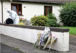  ??  ?? Probe: Gardaí at the scene where Peter McDonald, 77, died