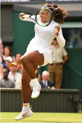  ??  ?? Serena Williams hits a return shot during her victory over Evgeniya Rodina