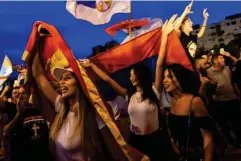  ?? (AFP/Getty) ?? Opposition supporters celebrate after the general election in Podgorica, Montenegro, on 31 August