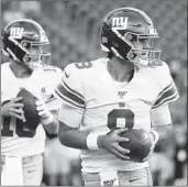  ?? ELISE AMENDOLA/AP ?? Daniel Jones, right, will make his first NFL start on Sunday in place of Giants icon Eli Manning, left.