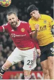  ?? ?? Luke Shaw and Raul Jimenez battle for the ball.