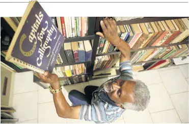  ?? Picture: Sandile Ndlovu ?? Even at home, retired librarian Deena Nair keeps tall shelves stacked with his beloved books.