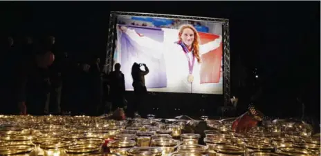  ?? VALERY HACHE/AFP/GETTY IMAGES ?? Stricken residents gather at a vigil in Nice on Tuesday. “All of France is grieving,” French Prime Minister Manuel Valls wrote on Twitter.