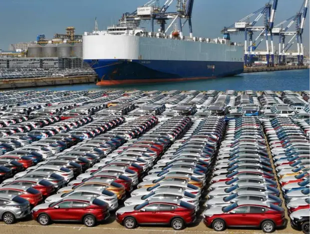  ?? STR/AFP VIA GETTY IMAGES ?? Buick vehicles were lined up before being loaded onto a ship for export at the port in Yantai, in China’s eastern Shandong province on Dec. 7. Hundreds of Buick dealership­s in the United States, including at least four in Massachuse­tts, are turning their backs on the storied brand.