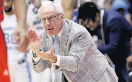 ?? GERRY BROOME/ASSOCIATED PRESS ?? North Carolina coach Roy Williams passed late mentor Dean Smith for fourth on the Division I men’s career coaching wins list, though it came nearly a month after Williams tied Smith in a win over Yale. Williams now has 880 victories and needs 19 more to tie Bob Knight.