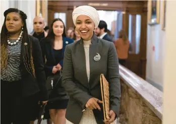  ?? JOSE LUIS MAGANA/AP ?? Rep. Ilhan Omar leaves the House chamber Thursday after being voted off the Foreign Affairs panel.