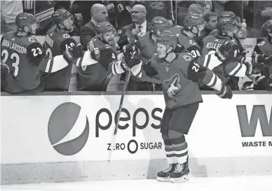  ??  ?? Coyotes center Nick Cousins (25) celebrates after scoring a goal in the first period vs. the Carolina Hurricanes on Friday.