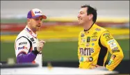  ?? John Locher / Associated Press ?? Denny Hamlin, left, and Kyle Busch talk in pit lane before qualifying for the NASCAR Cup Series auto race at Las Vegas Motor Speedway in Las Vegas.