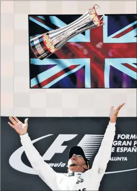  ?? Picture: GETTY IMAGES ?? CELEBRATIO­N TIME: Race winner Lewis Hamilton of Great Britain and Mercedes GP celebrates his win on the podium during the Spanish Formula One Grand Prix at Circuit de Catalunya in Montmelo, Spain yesterday