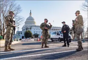  ?? J. Scott Applewhite / Associated Press ?? Heightened security remains around the U.S. Capitol since the Jan. 6 attacks by a mob of supporters of then-President Donald Trump. The U.S. Capitol Police say they have intelligen­ce showing there is a “possible plot” by a militia group to breach the U.S. Capitol on Thursday.