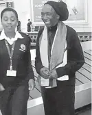  ??  ?? Thomas Mapfumo on stage (left) and the Zimbabwean music legend with an immigratio­n official at the Robert Mugabe Internatio­nal Airport in Harare