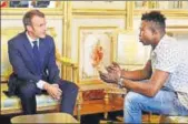  ?? REUTERS ?? French President Emmanuel Macron (L) meets with Mamoudou Gassama, 22, from Mali, at the Elysee Palace in Paris.