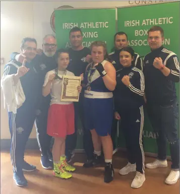  ??  ?? Daina Moorehouse and Bridget Cash with the Enniskerry Boxing Club’s coaching team.