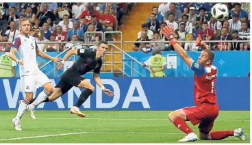  ?? — AP / Reuters ?? Winning strike: Croatia’s Ivan Perisic (centre) scoring the second goal against Iceland in the Group D match at the Rostov Arena on Tuesday. Top: Milan Badelj celebratin­g after scoring the first goal.