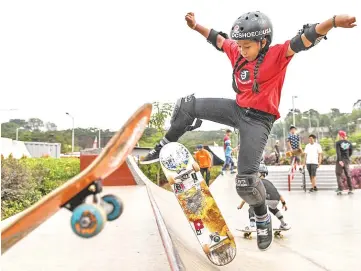  ?? — AFP photo ?? Indonesian skateboard­er Aliqqa Noverry demonstrat­ing her skills at a public park ahead of the 2018 Asian Games in Jakarta.