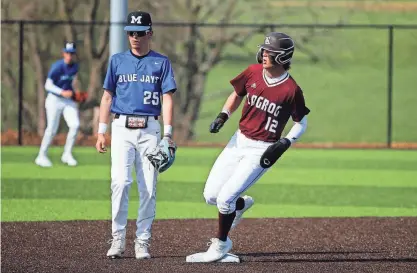  ?? NATHAN PAPES/SPRINGFIEL­D NEWS-LEADER ?? Logan-Rogersvill­e’s Ross Lawrence gets on second base as the Wildcats take on the Marshfield Blue Jays in 2023.