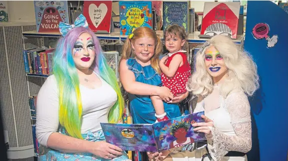  ?? Picture: Kim Cessford. ?? At the library are, from left, Hyperia, eight-year-old Abbigael Clark, one-year-old Emily Cross and Kat A Clysmic.