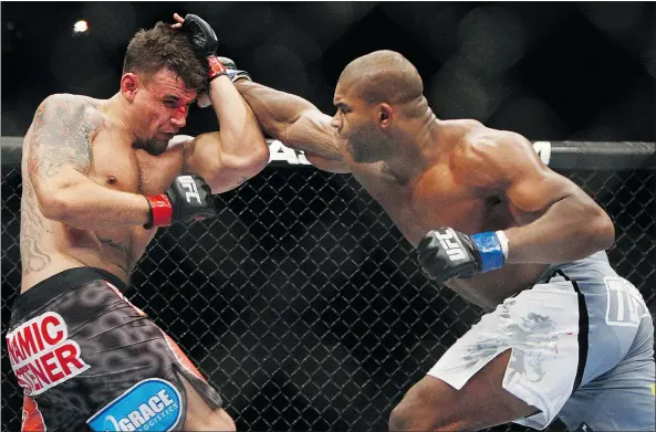  ?? — THE ASSOCIATED PRESS FILES ?? Alistair Overeem, right, seen fighting Frank Mir, will take on teammate Andrei Arlovski in Rotterdam this weekend.