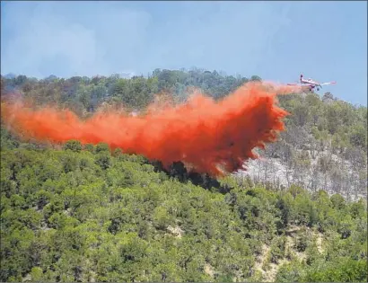  ?? Anna Stonehouse Aspen Times ?? FIGHTING the Lake Christine fire in Colorado’s Roaring Fork Valley bridged a classic red-blue divide in the community.