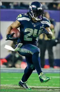  ?? AP/MARK HUMPHREY ?? Seattle officials said they want running back Marshawn Lynch to return for the 2015 season, but there has been no response from Lynch amid reports he is considerin­g retirement.