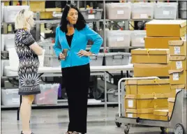  ?? Wilfredo Lee ?? The Associated Press Palm Beach County Supervisor Of Elections Susan Bucher, right, talks to an employee during a recount Thursday at her office in West Palm Beach, Fla.