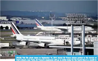  ??  ?? (FILES) This file photo taken on September 18, 2014 shows Air France planes parked on the tarmac at Orly’s airport, near Paris. Air France’s employees will go on strike today for the fourth time in a month to demand a six-percent general wage increase....