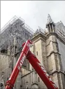  ?? THIBAULT CAMUS / ASSOCIATED PRESS ?? Notre Dame Cathedral undergoes renovation­s in Paris. Lead is ubiquitous in Paris’ 19th-century architectu­re — in roofs, gilded balconies, floors and terraces — and not just in its most famous cathedral.