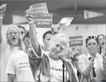  ?? Mel Melcon Los Angeles Times ?? DARA LASKY, center, a Venice resident since 1968 and homeowner since 1998, protests a proposed homeless shelter. In Sherman Oaks and Koreatown, other housing plans also encountere­d vociferous opposition.