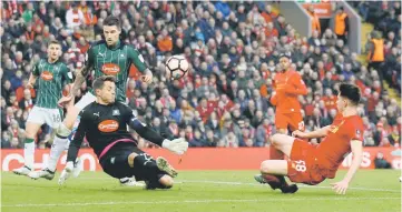  ??  ?? Liverpool’s Ben Woodburn shoots at goal during the FA Cup match between Liverpool and Plymouth Argyle at Anfield in Liverpool. — Reuters photo