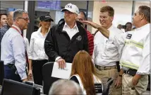  ?? EVAN VUCCI / ASSOCIATED PRESS ?? President Donald Trump and first lady Melania Trump tour the Texas Department of Public Safety Emergency Operations Center in Austin on Tuesday. The president and his wife came to Texas to assess Tropical Storm Harvey’s damage.