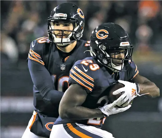  ?? DYLAN BUELL/GETTY IMAGES ?? Tarik Cohen (right) will reap big financial rewards if he plays better than he did last year, while Mitch Trubisky is fighting for his future as an NFL starter.