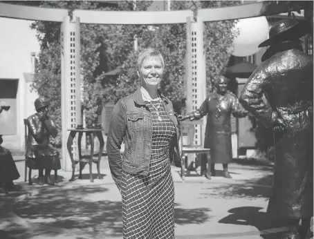  ?? KERIANNE SPROULE ?? Shauna Frederick, chair of the Famous 5 Foundation, stands among the Famous Five themselves at the Women are Persons! monument in Calgary’s Olympic Plaza. June 7 marked 100 years since the first two women — Louise McKinney and Roberta MacAdams — were...