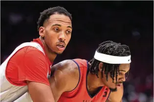  ?? DAVID JABLONSKI / STAFF ?? Zed Key (left) tries to box out UD’s DaRon Holmes II on a free-throw attempt in last season’s exhibition game at UD Arena. Key, the newest Flyer, spent four seasons at Ohio State.