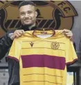  ??  ?? 0 Motherwell signing Jermaine Hylton with the new logo-free shirt.