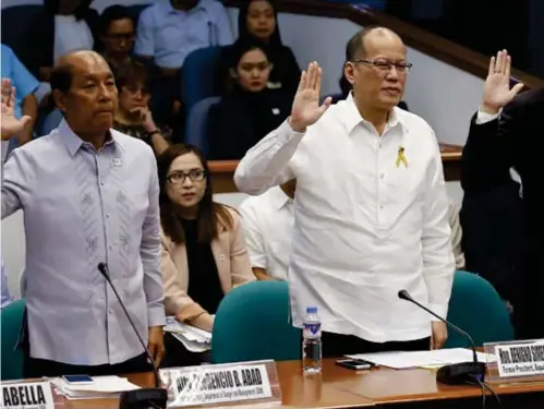  ?? (AP) ?? MANILA. Former Philippine President Benigno Aquino III takes his oath during the continuati­on of the Senate probe on the controvers­ial anti-dengue vaccine Dengvaxia Thursday, Dec. 14, 2017 in Pasay City.