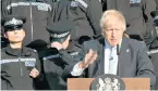  ??  ?? Going, going, gone: a trainee police officer has to sit down after feeling faint during Boris Johnson’s speech