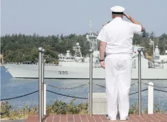  ?? ADRIAN LAM, TIMES COLONIST ?? Capt. (N) Steve Jorgensen salutes as HMCS Calgary passes Duntze Head for a five-month deployment to the Asia Pacific region.