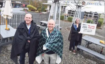  ?? Arnold Gold / Hearst Connecticu­t Media ?? From left, Gerry Barker, Rob Kauffman, co-owner of The Stand, and server Keya Recchia are photograph­ed in the outdoor dining area of The Stand in Branford on Oct. 16, to promote the “Bring Your Own Blanket” campaign for outdoor dining in colder months.