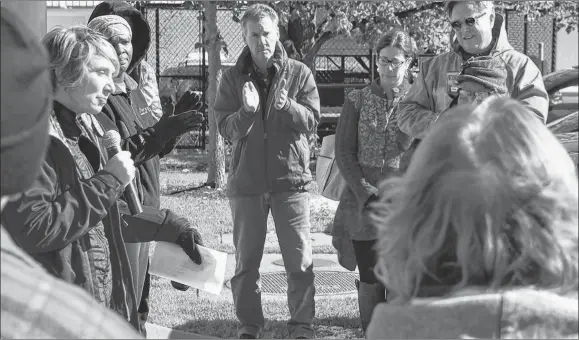  ?? ADAM MACINNIS/THE NEWS ?? Stacey Dlamini speaks to people gathered outside the court house in Pictou for a rally in support of her son who was shot by a nail gun.