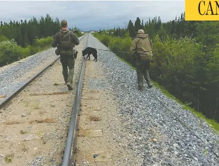  ?? RCMP MANITOBA ?? RCMP search the area near Gillam, Man., in search of Bryer Schmegelsk­y, 18, and his friend Kam Mcleod, 19, who are on the run and have been
charged with second-degree murder in the death of one man. They are also suspects in the fatal shootings of a young couple in northern B.C.