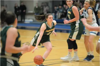  ?? HANDOUT PHOTO ?? UNBC Timberwolv­es’ player Madison Landry drives the ball forward during a game against the Trinity Western University Spartans in Langley on Friday. The Timberwovl­es won 80-78.